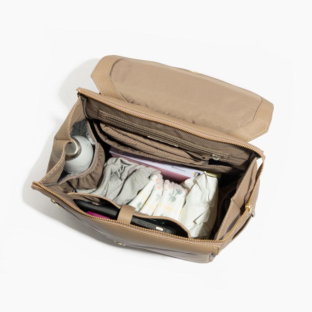 Interior view of the Aspen Diaper Bag II, fully stocked with baby essentials.