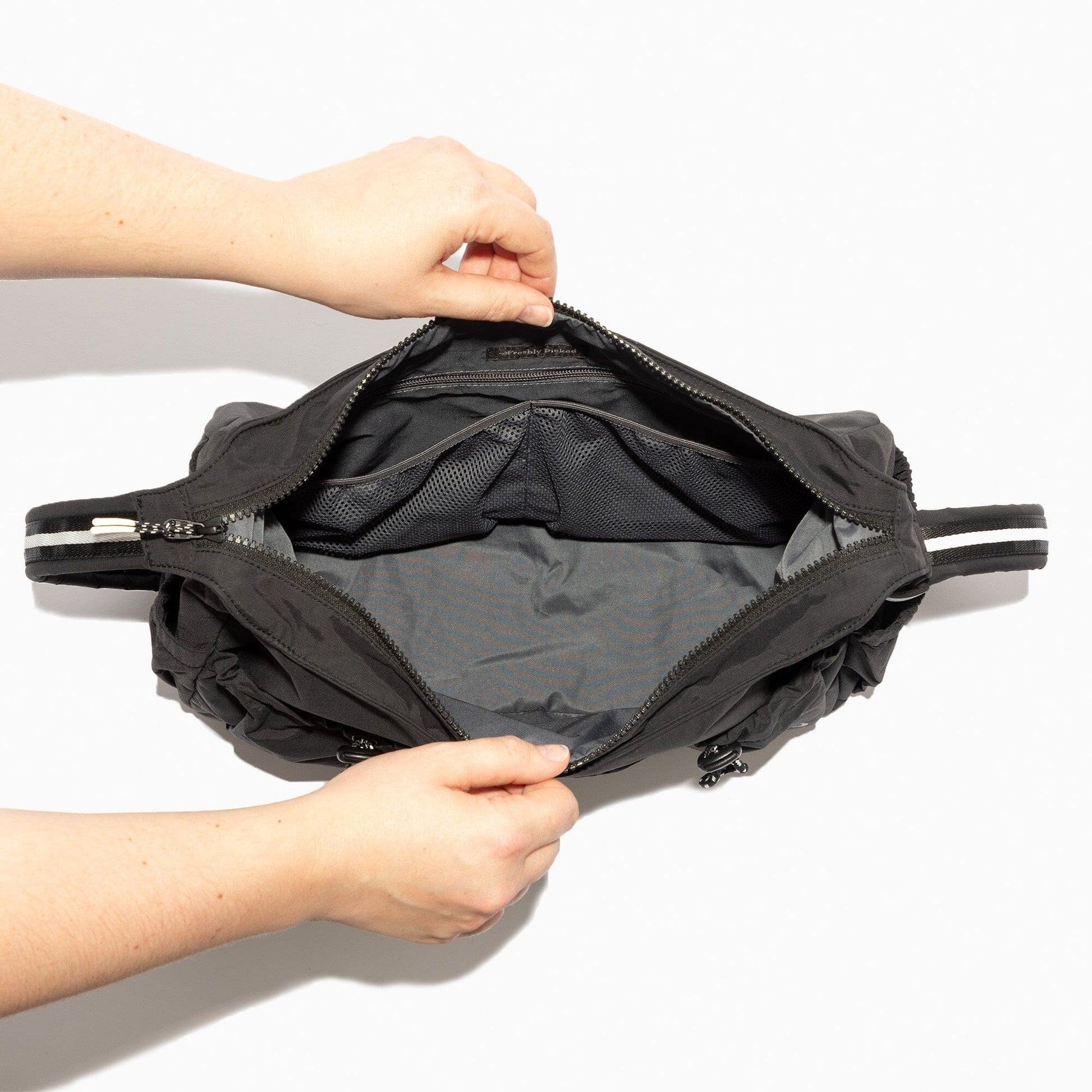 Inside view of the Jet Motion Carryall Tote showing the interior compartments.