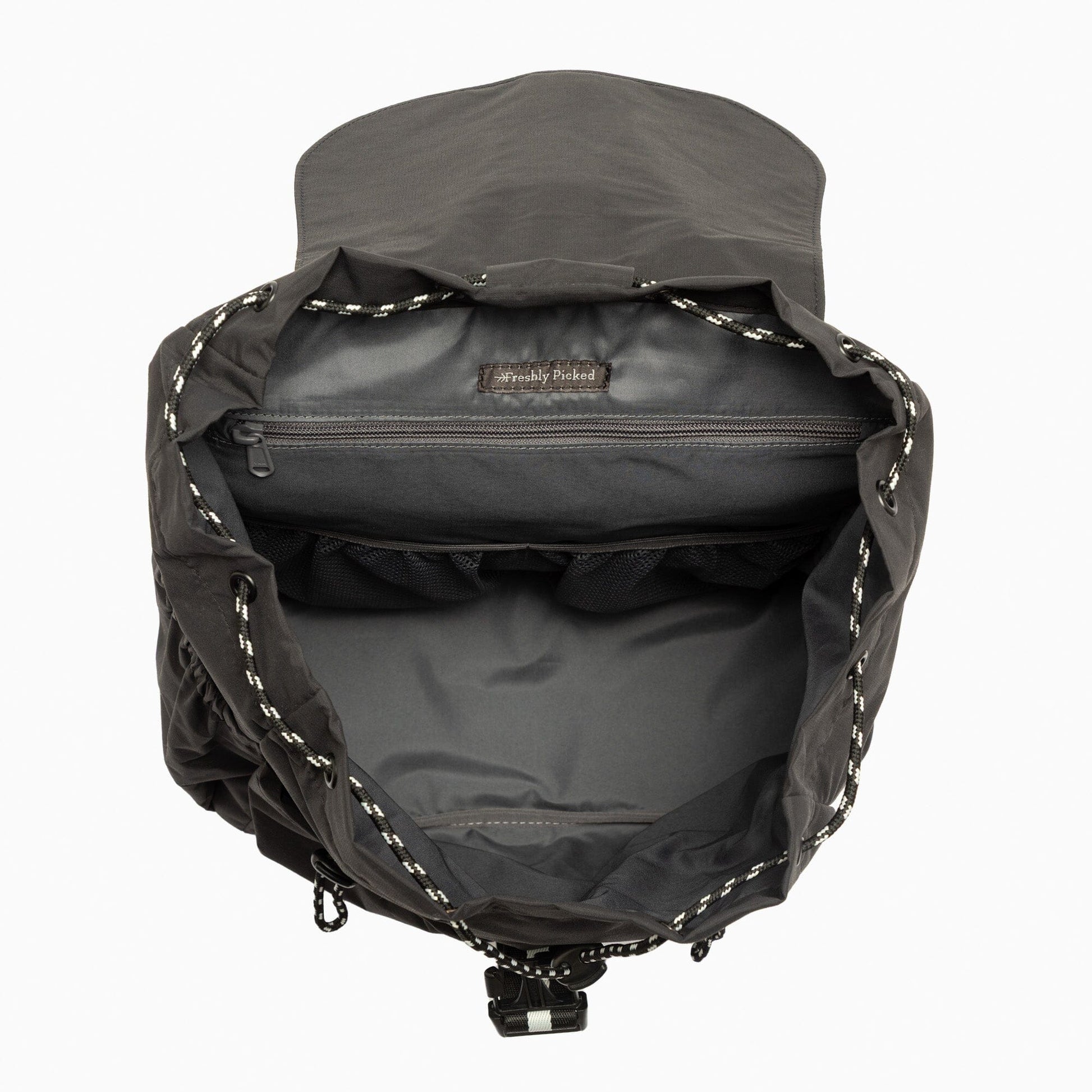 Jet Motion Drawcord Backpack in black, showcasing interior pockets