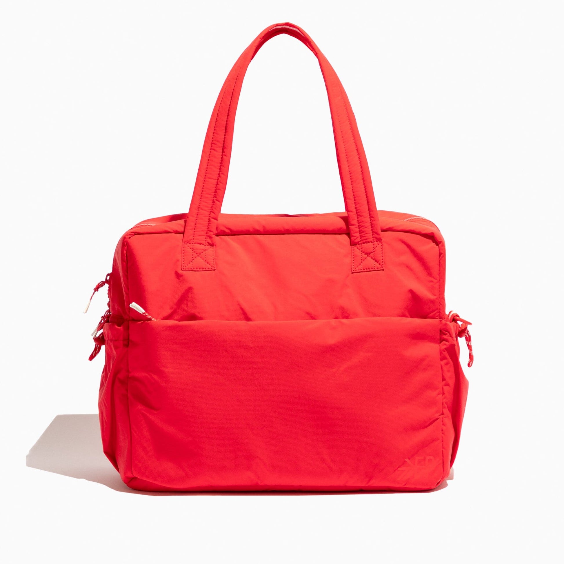Front view of the Cherry Motion Overnight Duffle bag in red.
