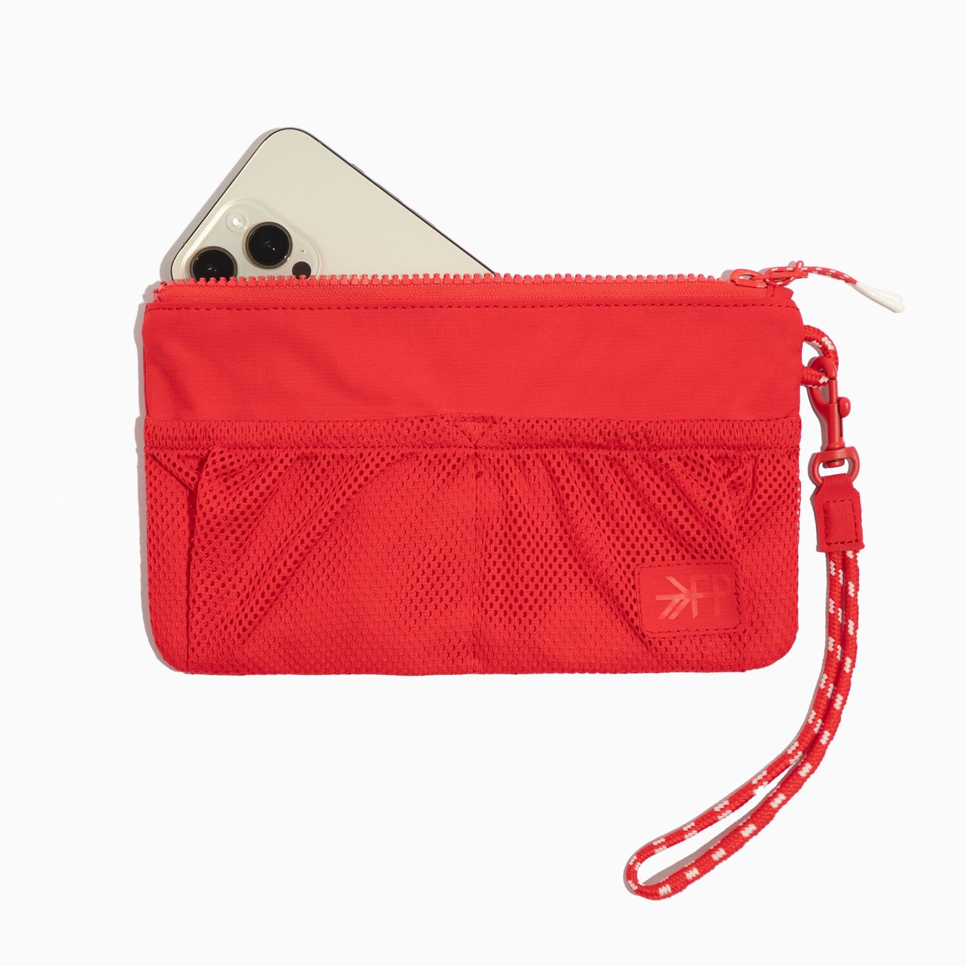 Cherry Motion Wristlet Pouch in red with a phone inside.