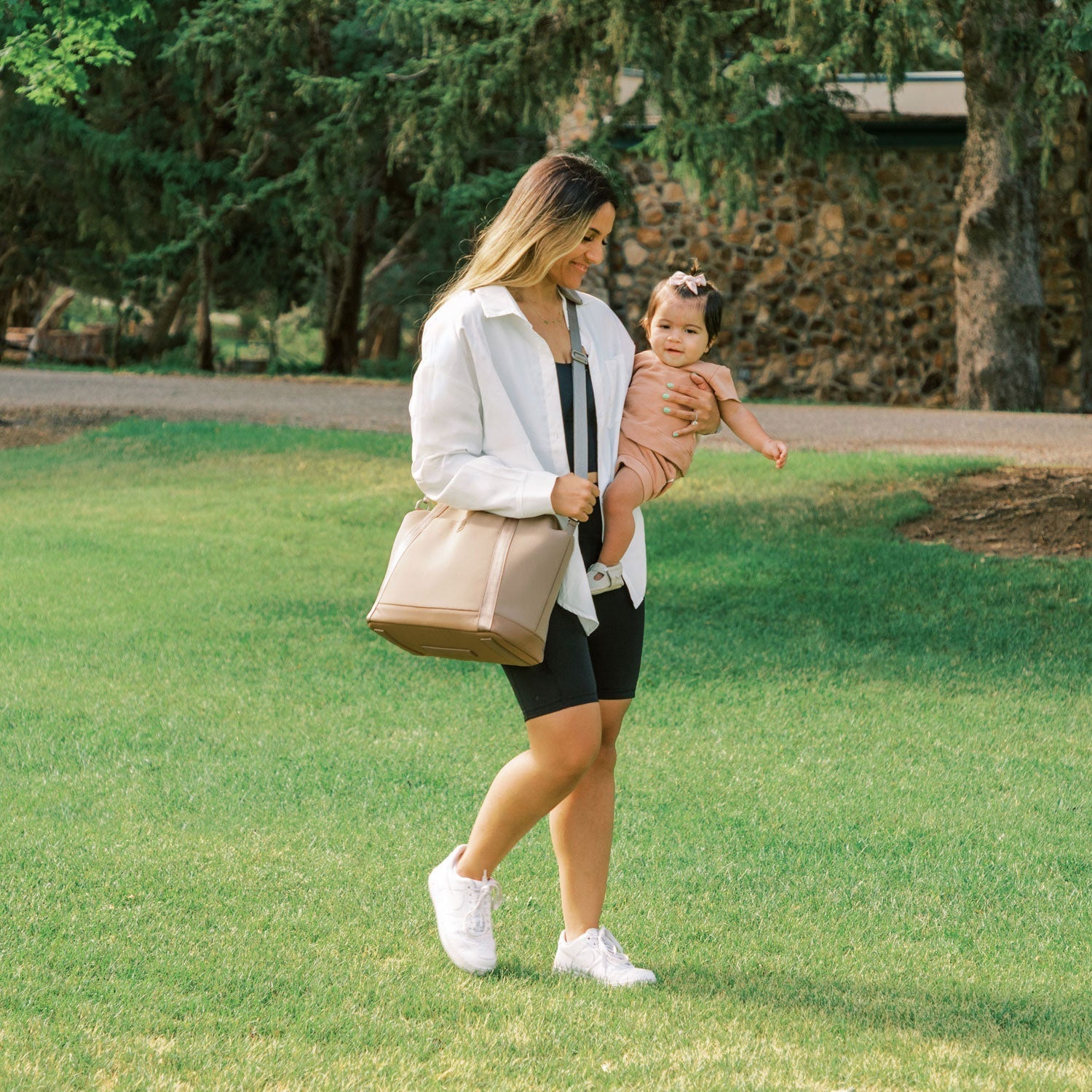 Woman with baby, wearing Aspen Seoul Neoprene Tote