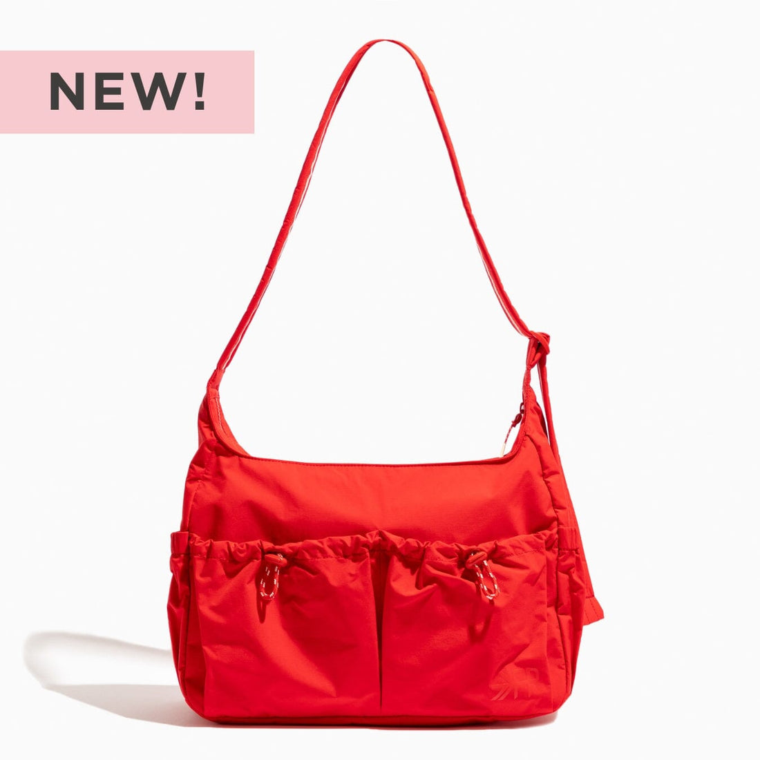 Cherry Motion Carryall Tote bag in bright red nylon with shoulder strap.