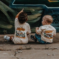 Toddler boy wearing 'Where the Rad Things Are' graphic tee.