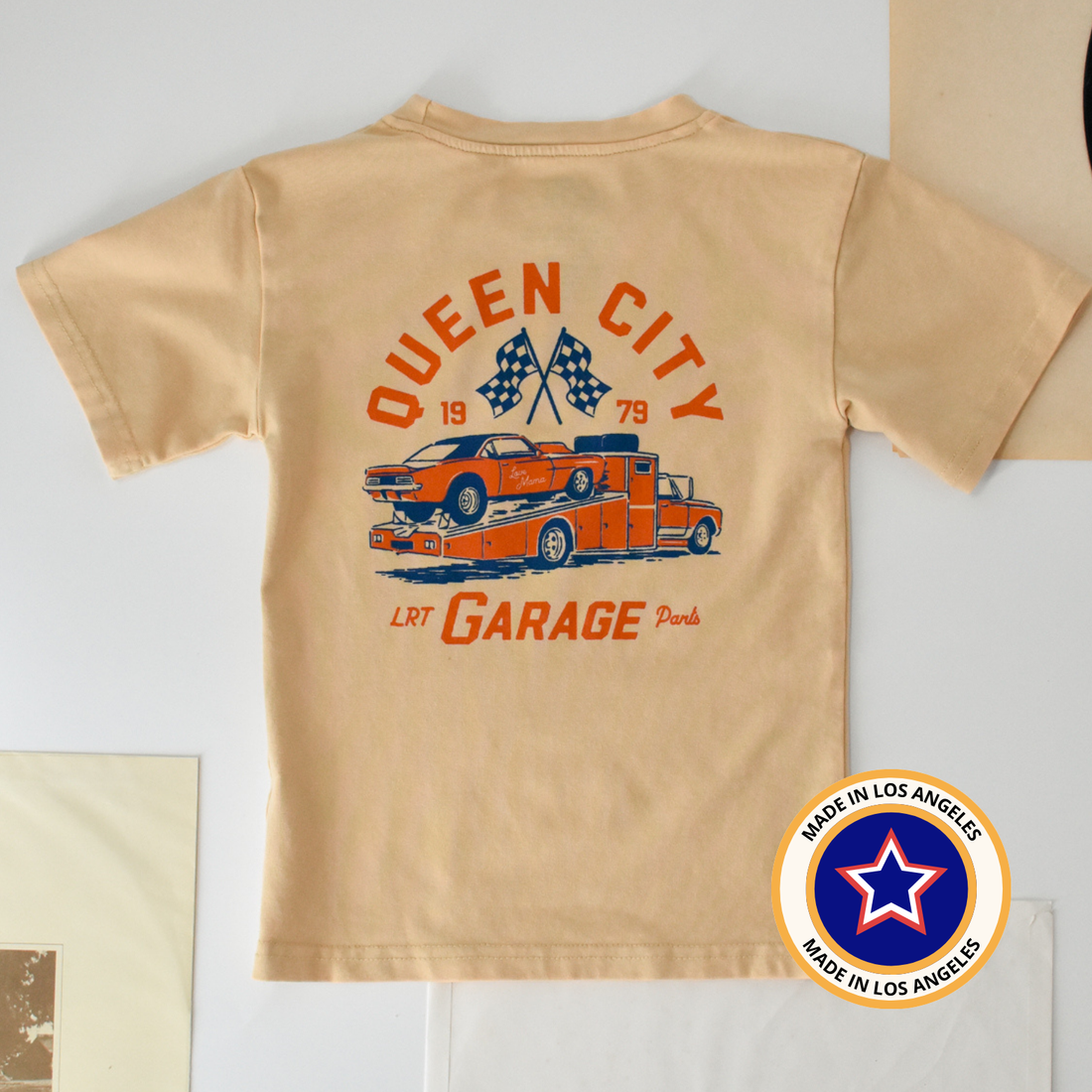 Queen City Garage Tee - Vintage Cream back graphic with race car and garage parts.