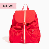 Cherry Motion Drawcord Backpack in red with white stripe detail.