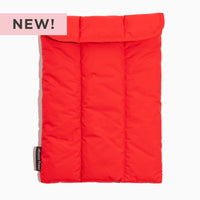 Cherry Motion Laptop Sleeve in vibrant red, padded and quilted design.