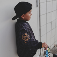 Boy in checkered letterman jacket