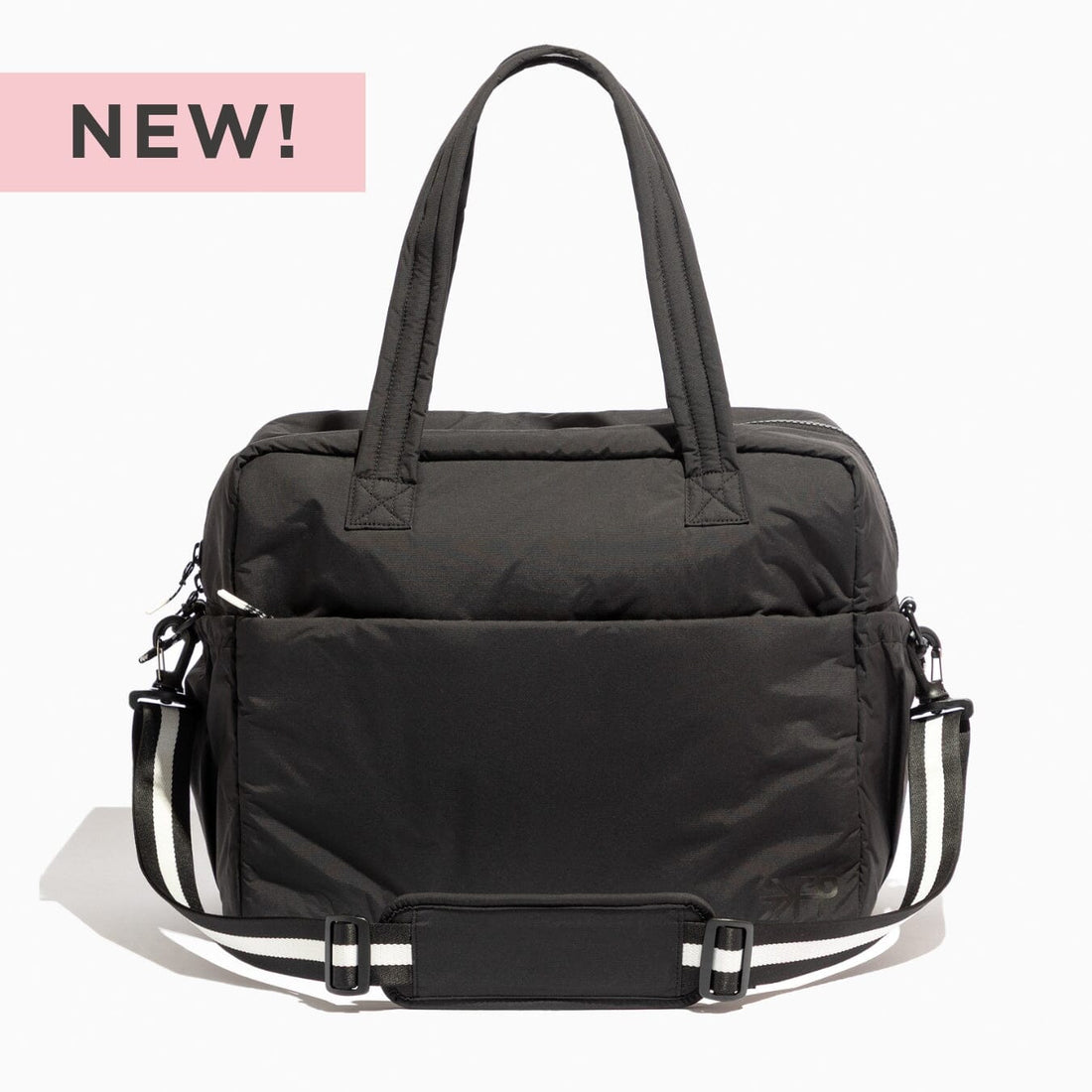 Jet Motion Overnight Duffle in black with top handles and shoulder strap, 'NEW!' badge.