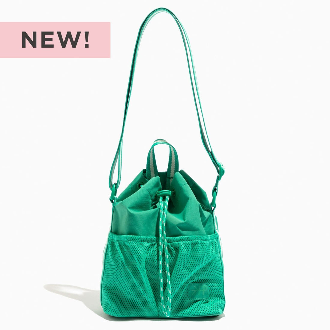 Kelly Motion Bucket Crossbody bag in green with drawstring and crossbody strap.