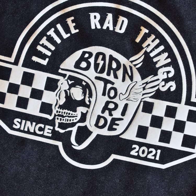 Close-up of 'Born To Ride' skull graphic on toddler t-shirt
