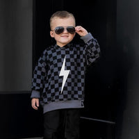 Close-up of the black checkered Spark Hoodie.