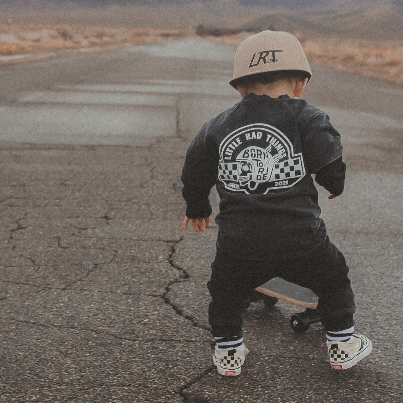 Toddler on bike wearing 'Til Death Do We Ride' graphic tee