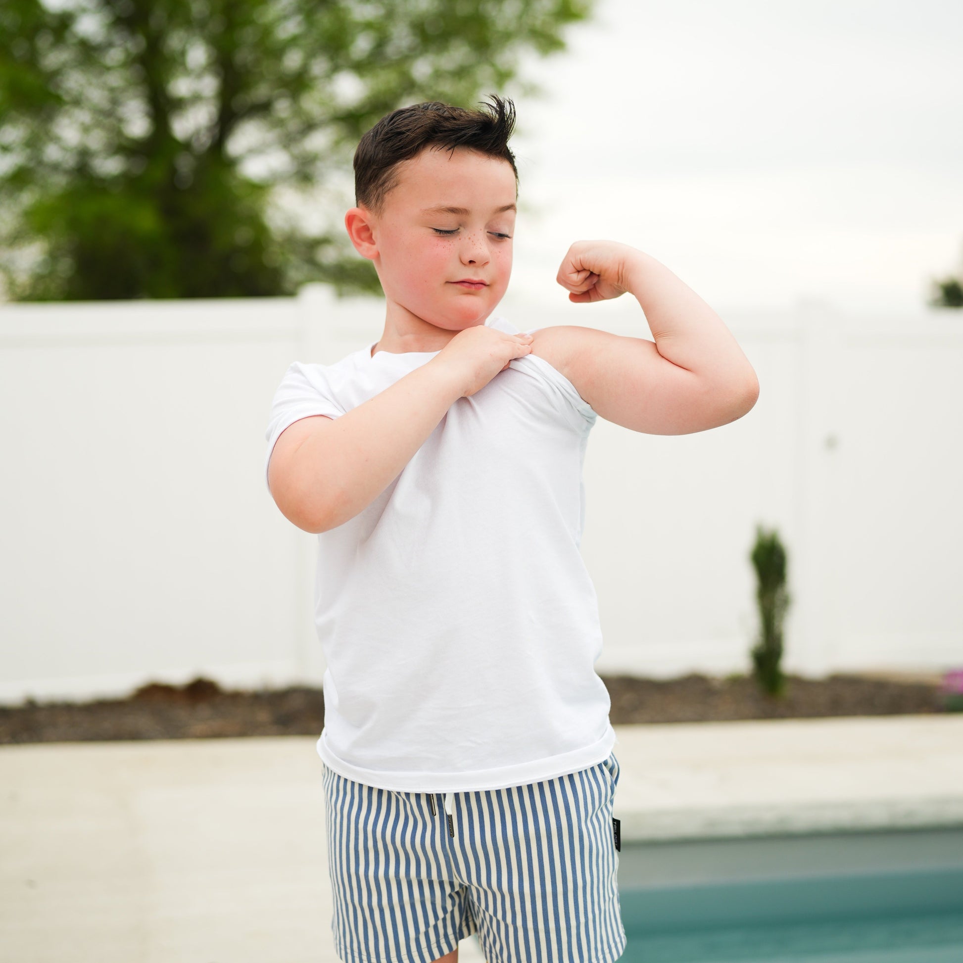 Boy in RAD Organics white organic cotton tee shirt.