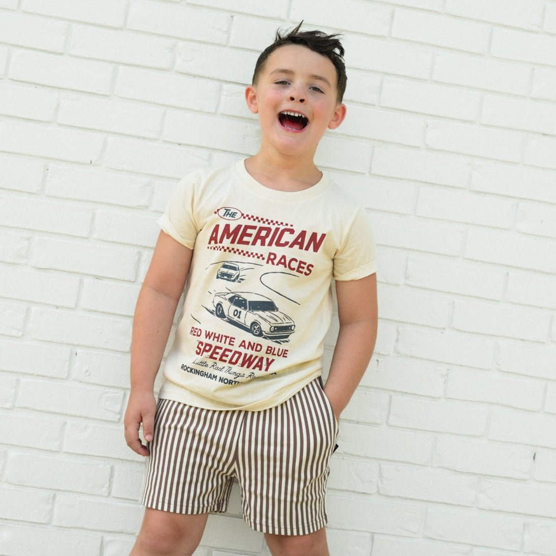Cream tee for kids featuring The All American Races graphic.