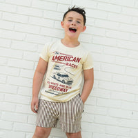 Cream tee for kids featuring The All American Races graphic.