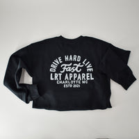 Flat lay of black Apex crewneck sweatshirt with 'Drive Hard Live Fast' graphic.