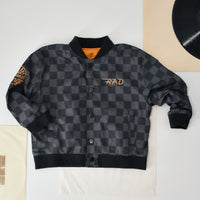 Boy in checkered letterman jacket