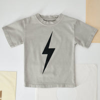 Greige acid wash Spark Tee with bold black lightning bolt design