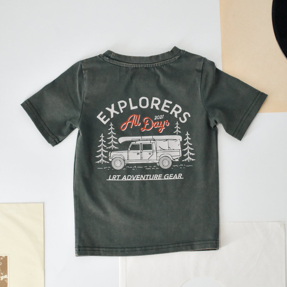 Sage green Explorer tee with vintage-inspired truck graphic.