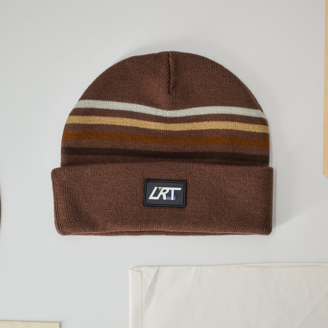 Cocoa Vintage Stripes Beanie with a black LRT rubber patch.
