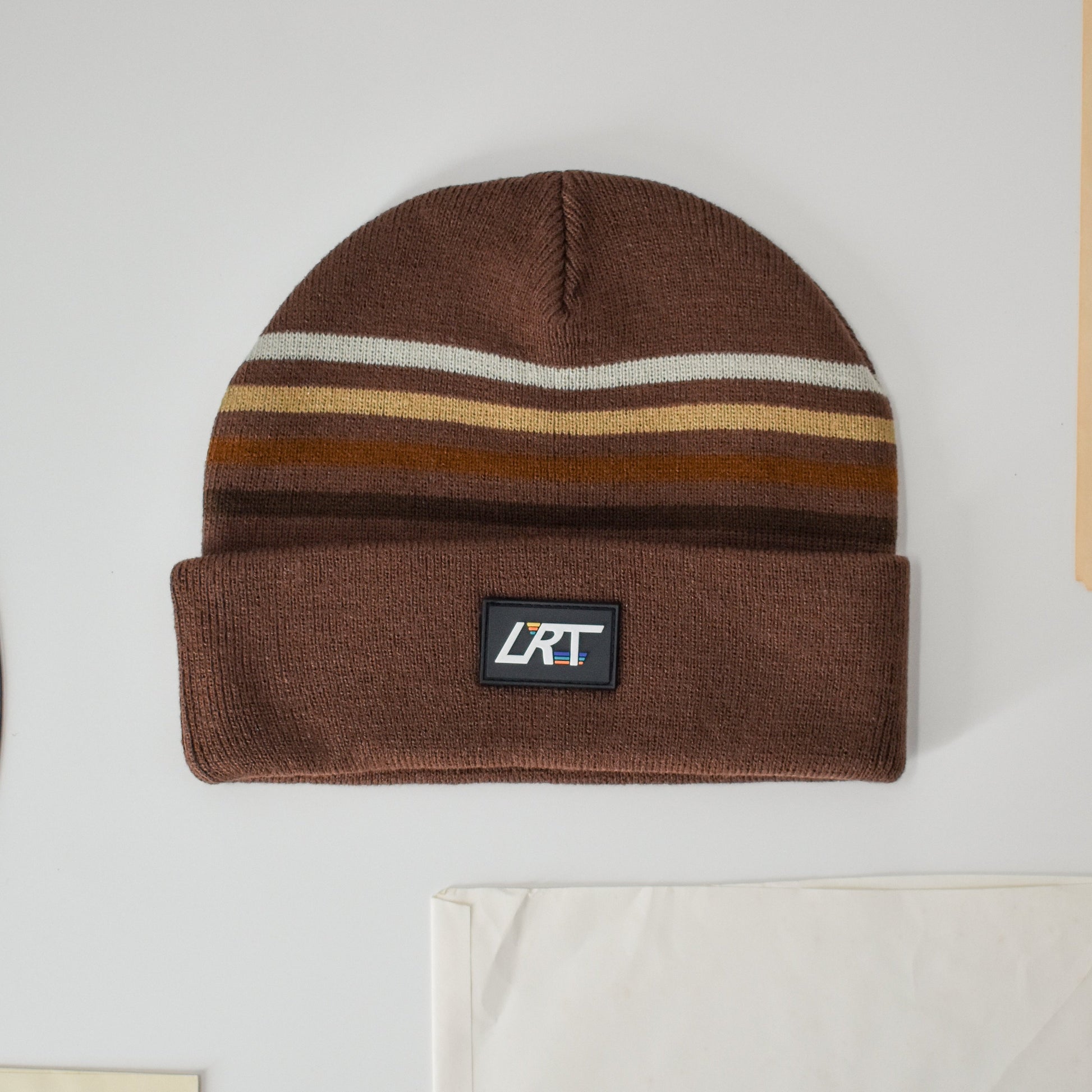 Cocoa Vintage Stripes Beanie with a black LRT rubber patch.