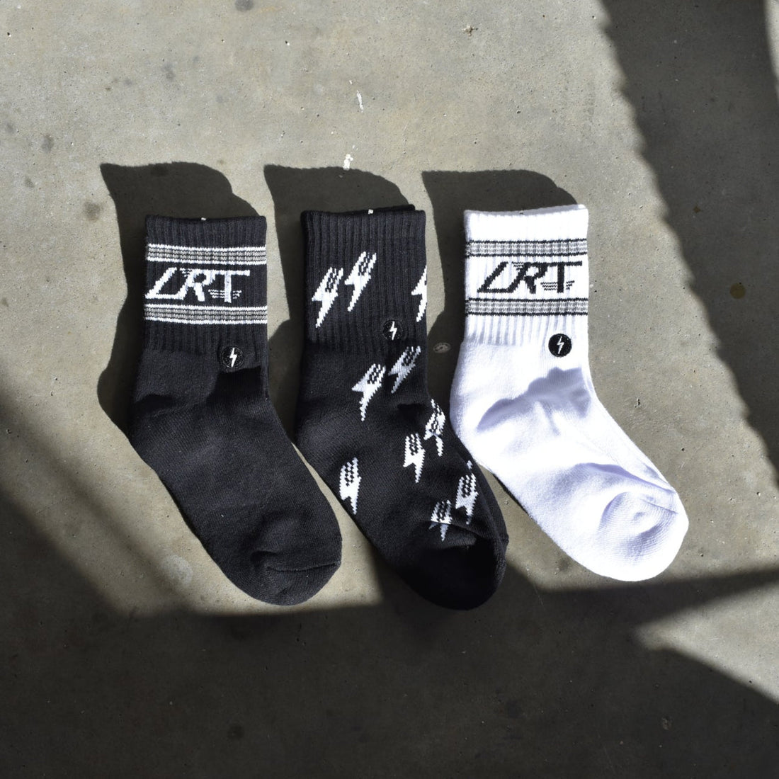 Three pairs of Classic Rock socks in black and white with the LRT logo.