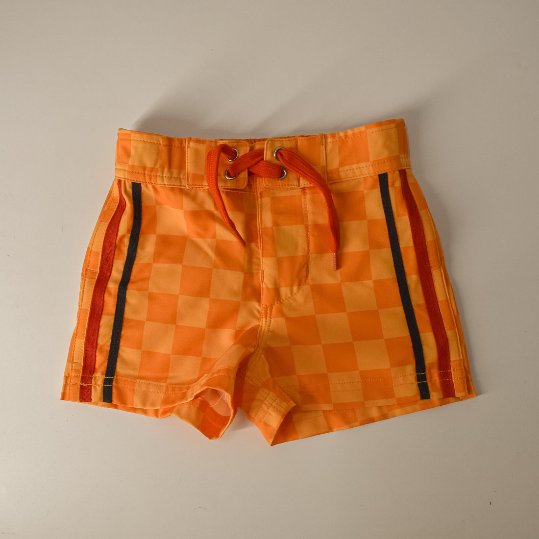 Retro-wave yellow checkerboard board shorts with a drawstring waist.