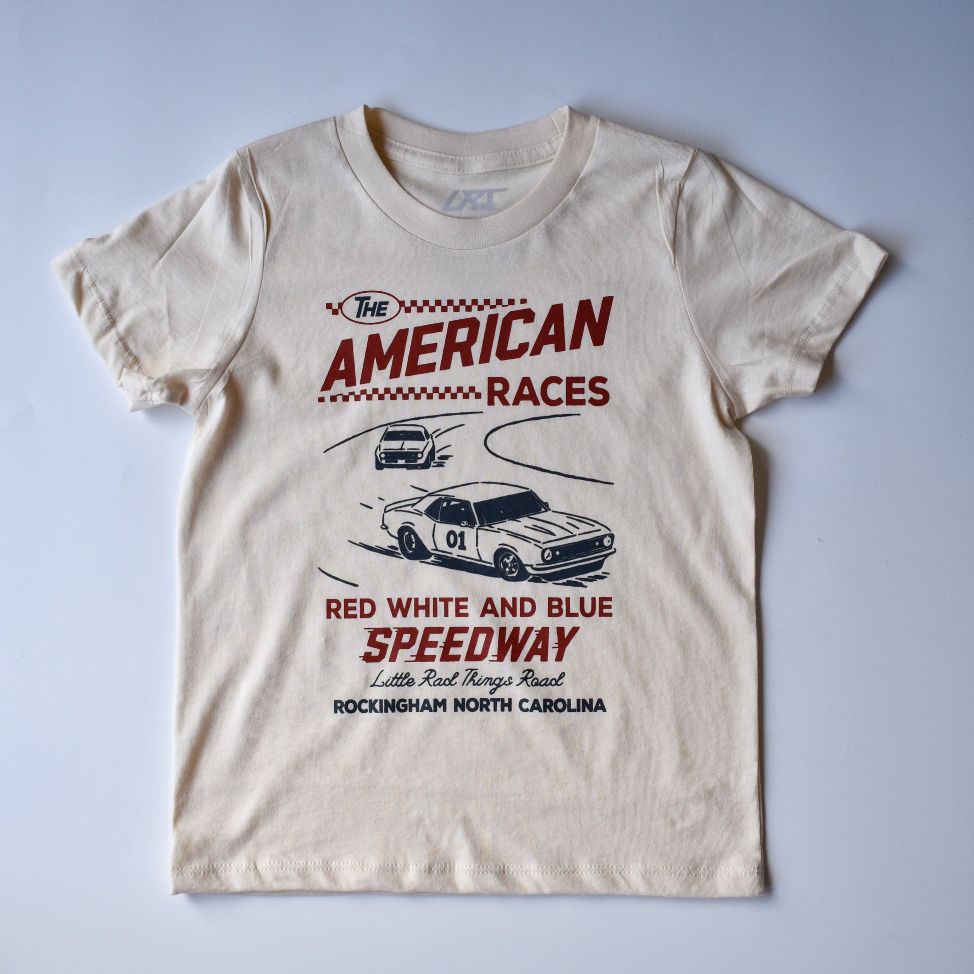 Cream colored The All American Races Tee with car graphic.