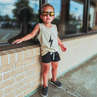 Cool toddler in greige Spark Muscle Tank and black shorts