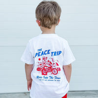 Boy wearing white Peace Trip Tee with motorcycle graphic