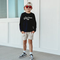 Child wearing Good Times Cafe long sleeve with sunglasses and hat.