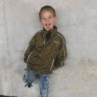 Army green Storm Rider waterproof jacket with checkerboard pattern.