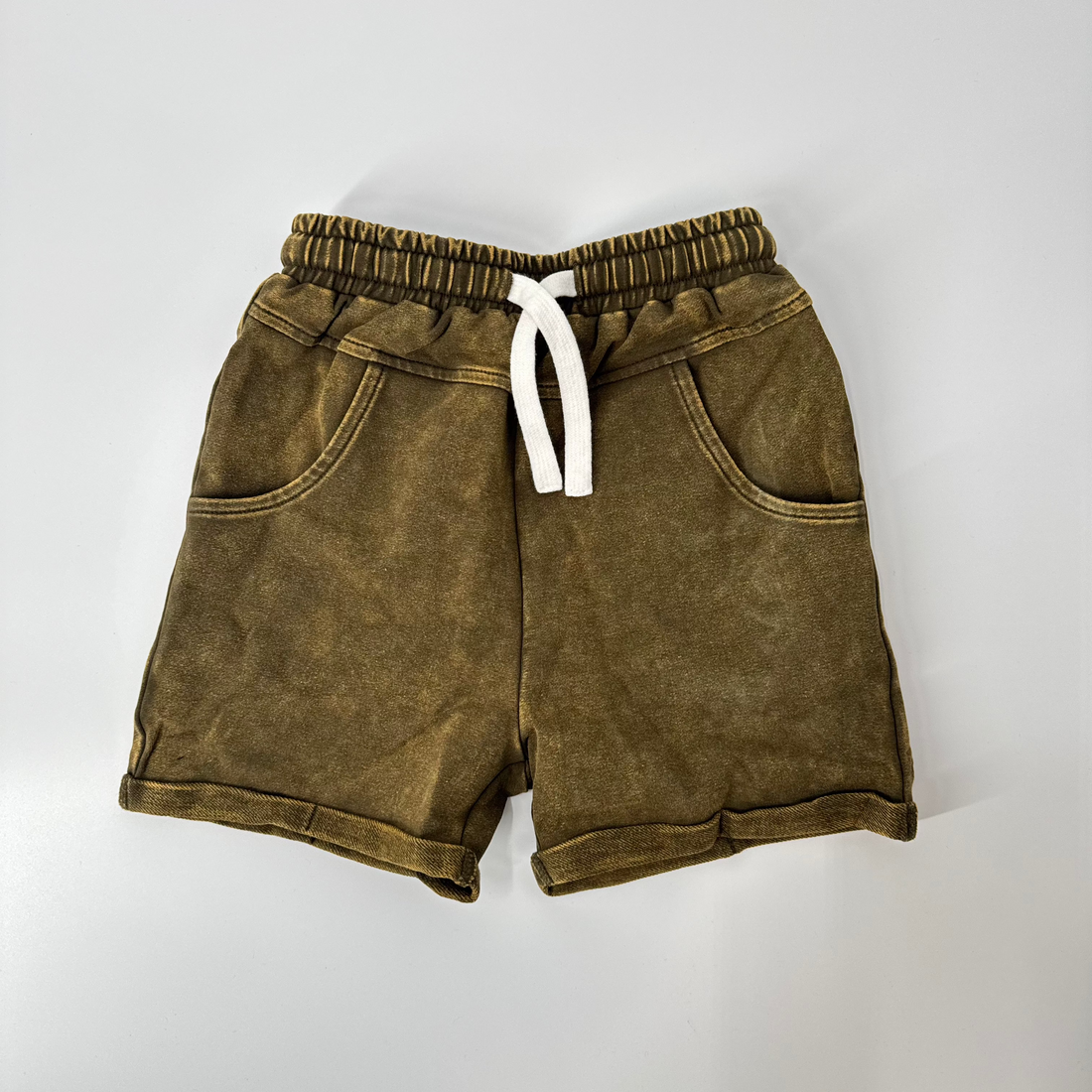 Army green vintage wash shorts with drawstring waist, flat lay.