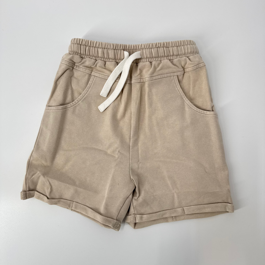 Khaki vintage wash shorts for kids with elastic waistband and drawstring.