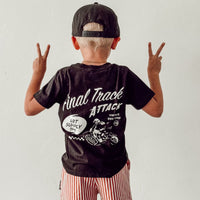 Boy wearing black Final Track Attack Tee with peace signs.
