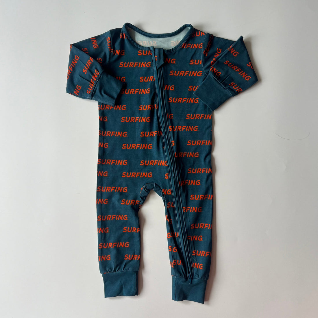 Ocean Cubs Wear Pipeline Dreams double zip footless sleeper, surfing print.