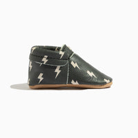 Side view of Ebony Lightning City Baby Shoe, showing elastic opening.