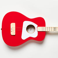 Close-up of red Loog Pro Acoustic guitar body