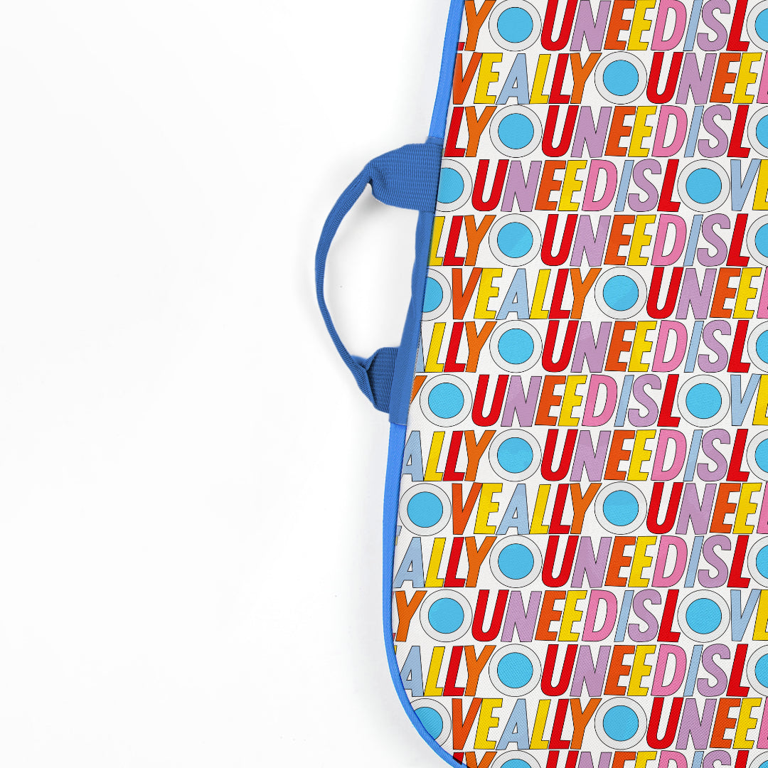 Detail of the Beatles Loog Gig Bag, showing the blue handle and text design.