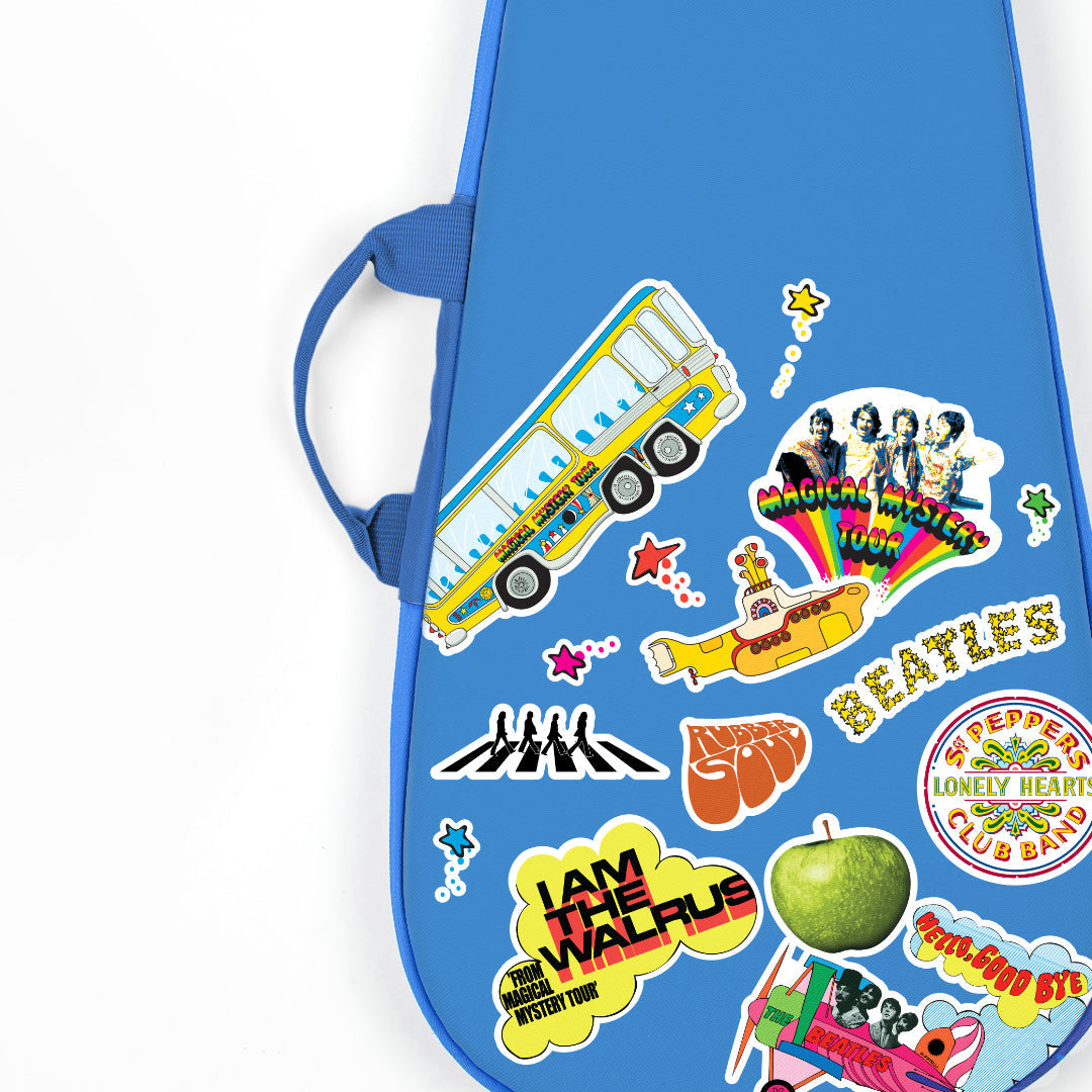 Close-up of the Beatles guitar bag showcasing Magical Mystery Tour and Abbey Road graphics.
