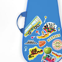 Close-up of the Beatles guitar bag showcasing Magical Mystery Tour and Abbey Road graphics.