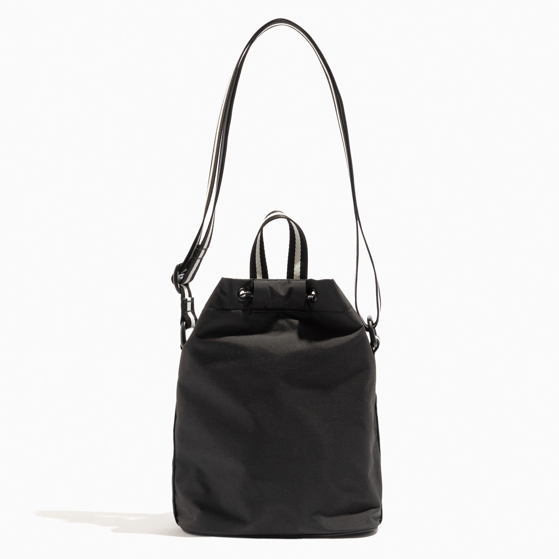 Front view of the Jet Motion Bucket Crossbody bag with a striped strap.