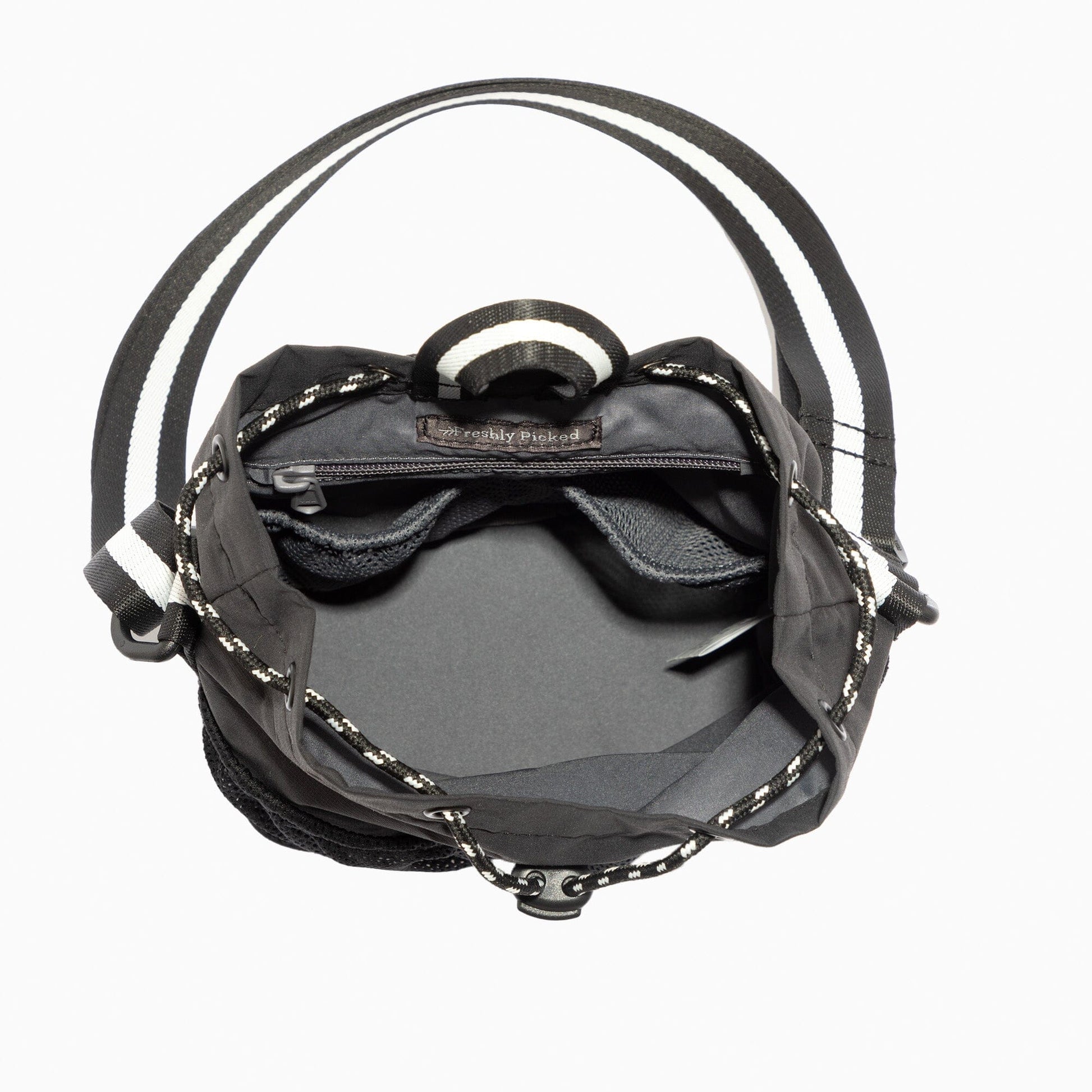 Interior view of the Jet Motion Bucket Crossbody bag showing pockets and spacious compartment.