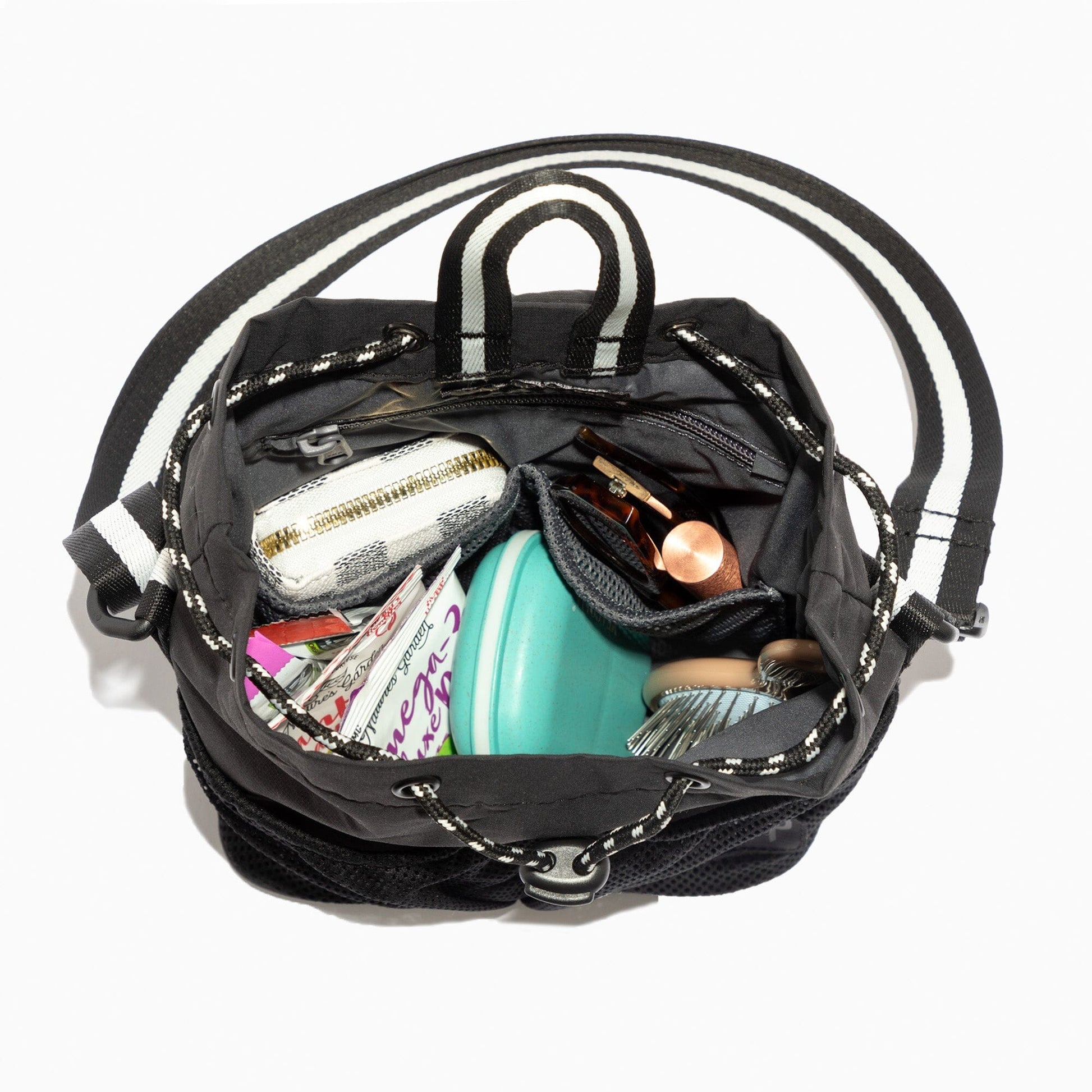 Kelly Motion Bucket Crossbody bag in green with drawstring and crossbody strap.