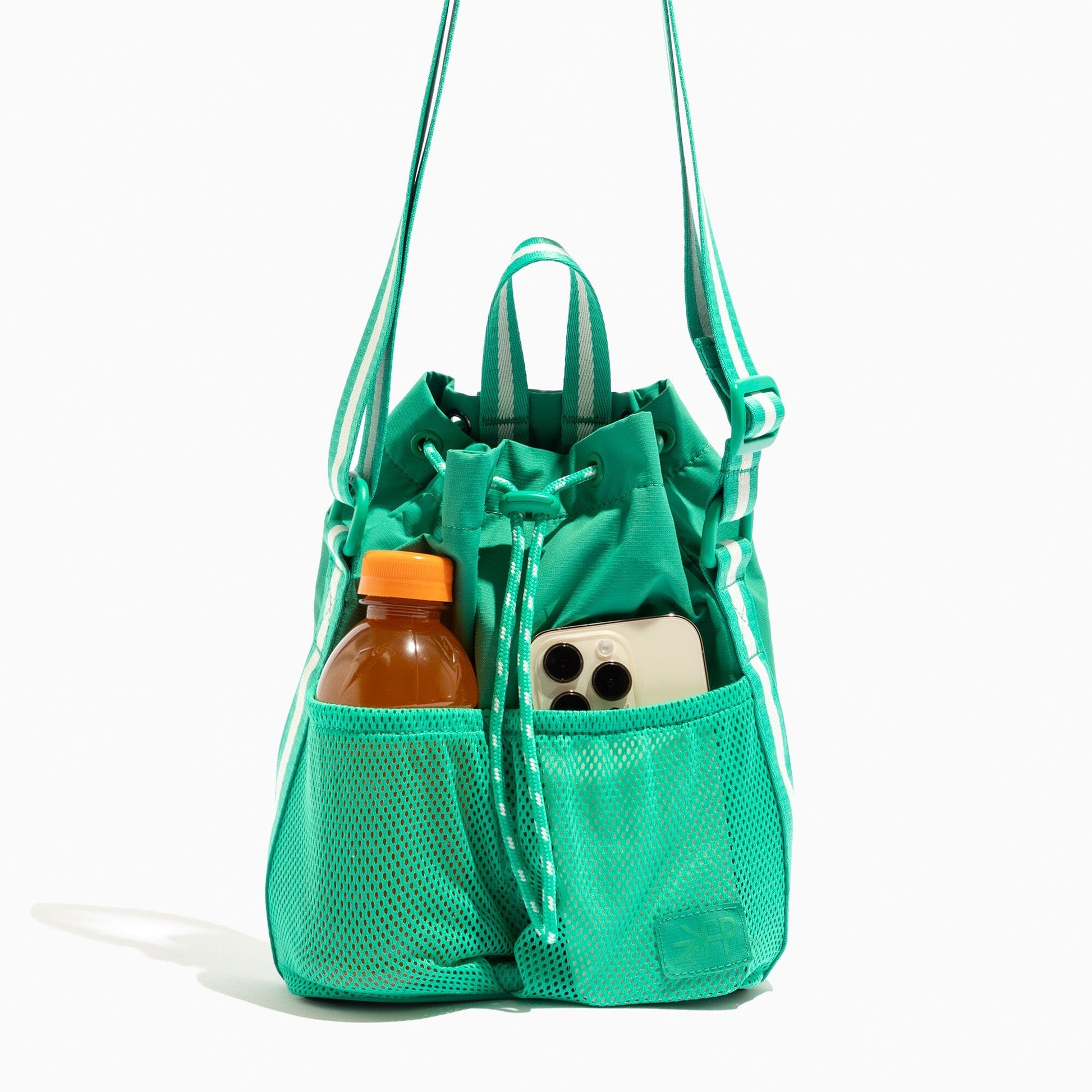 Kelly Motion Bucket Crossbody bag in green with drawstring and crossbody strap.