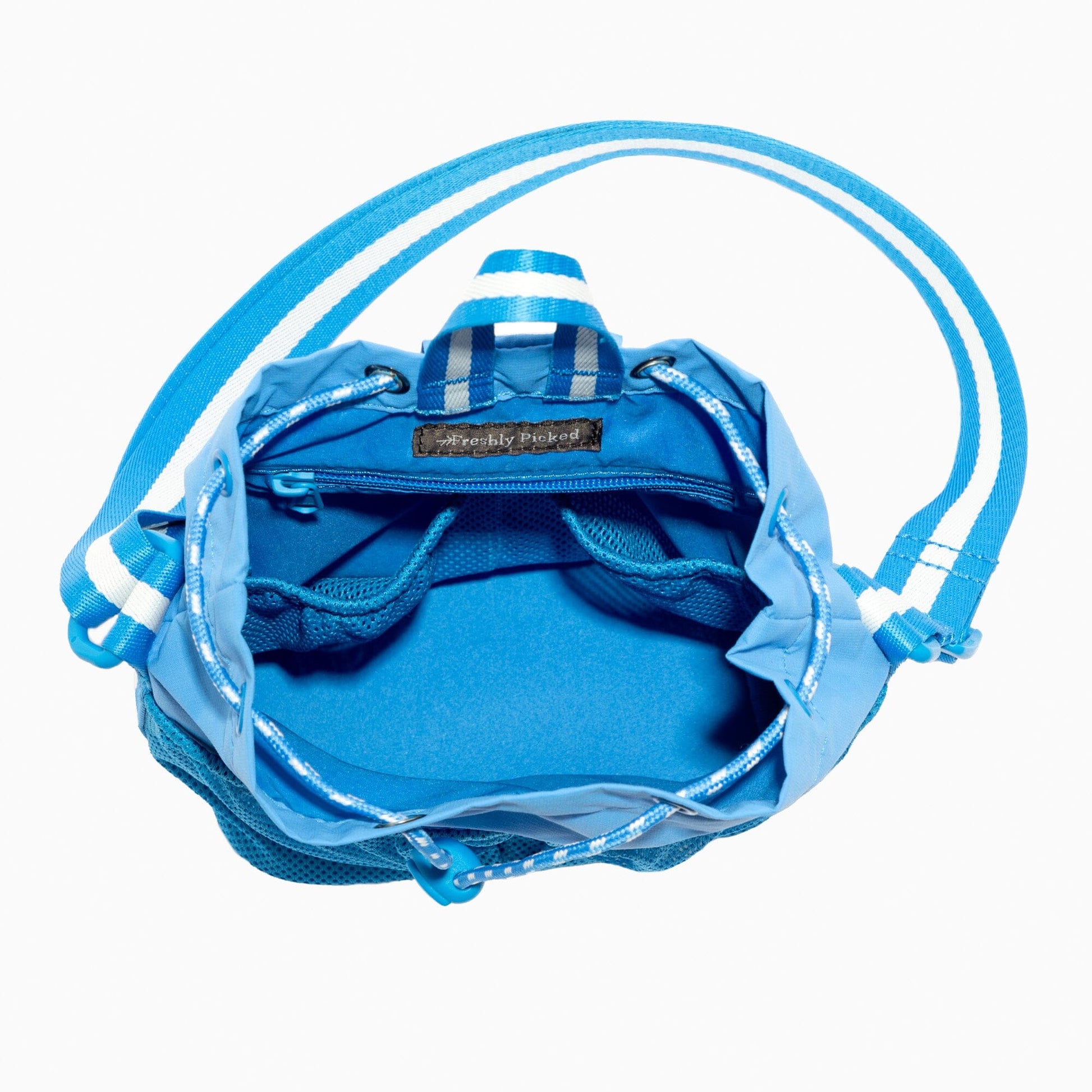 Interior view of the blue Wave Motion Bucket Crossbody bag showing pockets.
