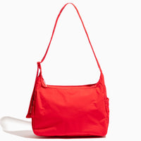 Studio shot of a red Cherry Motion Carryall Tote bag.