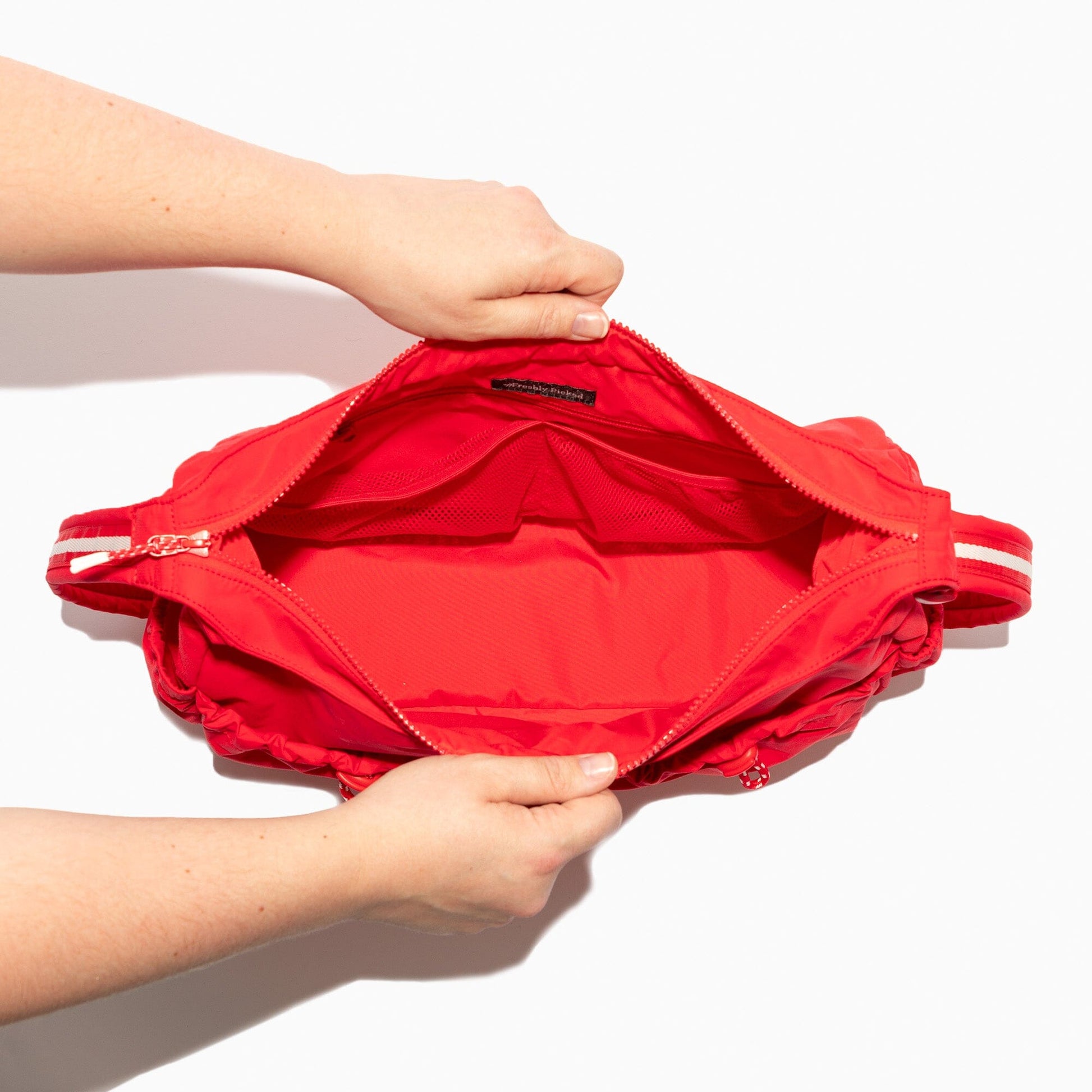 Interior view of the Cherry Motion Carryall Tote bag, showing pockets.
