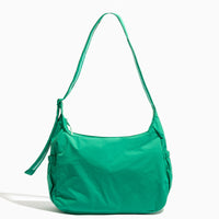 Front view of the Kelly Motion Carryall Tote in green.